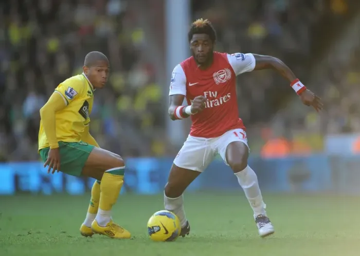Framed Print : Arsenal's Alex Song Clashes with Norwich's Simeon Jackson in Premier League Showdown at Carrow Road, November 19, 2011