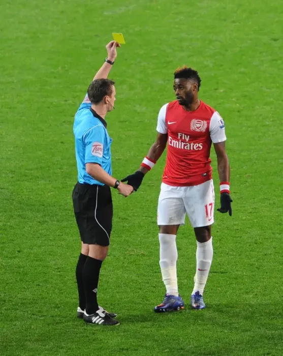 Framed Print : Arsenal's Alex Song Shown Yellow Card by Referee Stuart Attwell (2011-2012) Framed Print : Arsenal's Alex Song Shown Yellow Card by Referee Stuart Attwell (2011-2012)