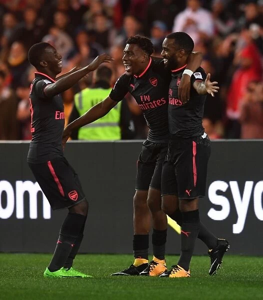 Arsenal's Alexandre Lacazette, Alex Iwobi, and Eddie Nketiah Celebrate Goals Against Sydney FC