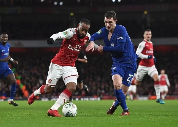 Arsenal's Alexandre Lacazette Clashes with Chelsea's Andreas Christensen in Carabao Cup Semi-Final Showdown