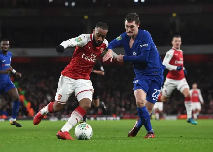 Framed Print : Arsenal's Alexandre Lacazette Clashes with Chelsea's Andreas Christensen in Carabao Cup Semi-Final Showdown