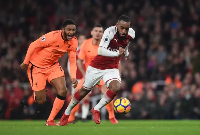Framed Print : Arsenal's Alexandre Lacazette Clashes with Liverpool's Joe Gomez in Premier League Showdown