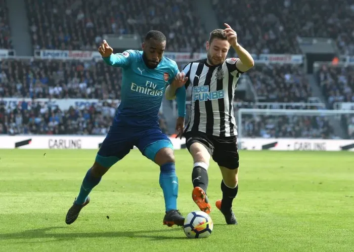 Framed Print : Arsenal's Alexandre Lacazette Clashes with Newcastle's Paul Dummett in Premier League Showdown Framed Print : Arsenal's Alexandre Lacazette Clashes with Newcastle's Paul Dummett in Premier League Showdown