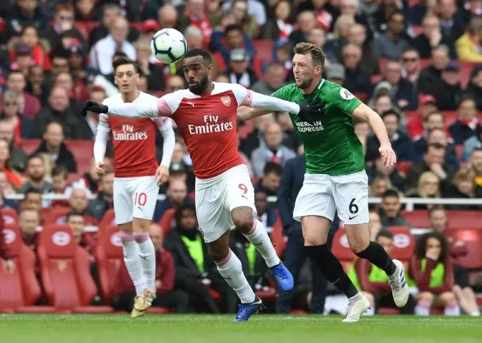Framed Print : Arsenal's Alexandre Lacazette Faces Off Against Brighton's Dale Stephens in Premier League Showdown