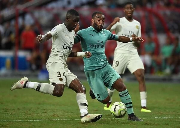 Arsenal's Alexandre Lacazette Faces Off Against PSG's Stanley Nsoki in International Champions Cup 2018