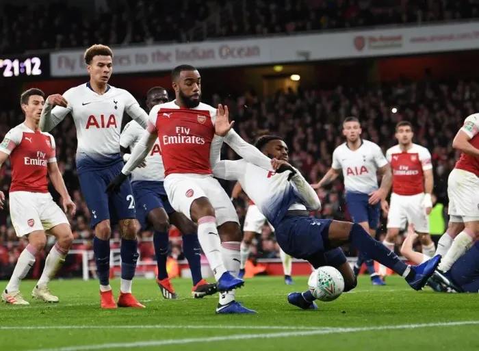 Framed Print : Arsenal's Alexandre Lacazette Faces Off Against Tottenham's Danny Rose in Carabao Cup Quarterfinal Showdown Framed Print : Arsenal's Alexandre Lacazette Faces Off Against Tottenham's Danny Rose in Carabao Cup Quarterfinal Showdown