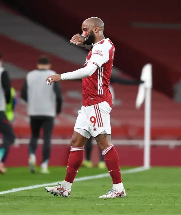 Framed Print : Arsenal's Alexis Lacazette Suffers Injury in Empty Emirates Stadium During Arsenal v Liverpool Premier League Clash (2020-21)