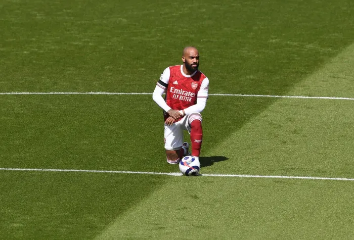 Framed Print : Arsenal's Alexis Lacazette Takes a Knee at Empty Emirates Stadium: Arsenal v Fulham, Premier League 2020-21