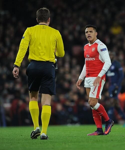 Arsenal's Alexis Sanchez Argues with Referee during Arsenal v Paris Saint-Germain UCL Clash