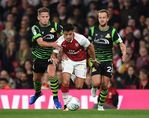 Arsenal's Alexis Sanchez Clashes with Doncaster's Jordan Coppinger in Carabao Cup Showdown