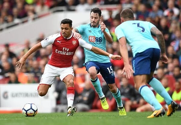 Arsenal's Alexis Sanchez Faces Off Against AFC Bournemouth's Adam Smith