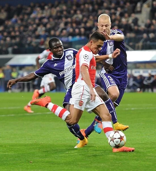 Arsenal's Alexis Sanchez Faces Off Against Anderlecht Defenders Olivier Deschacht and Frank Acheampong