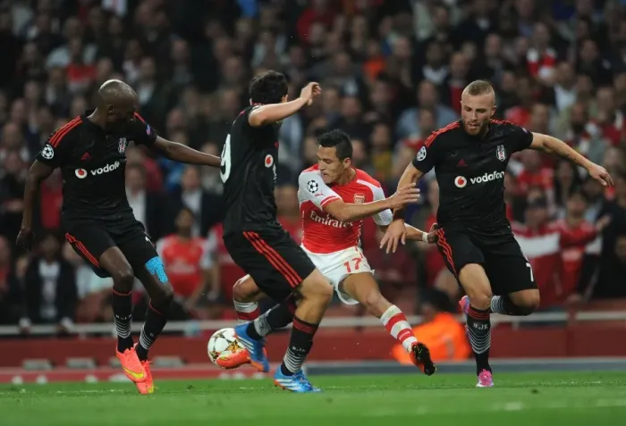 Framed Print : Arsenal's Alexis Sanchez Faces Off Against Besiktas Trio in 2014 Champions League Qualifier