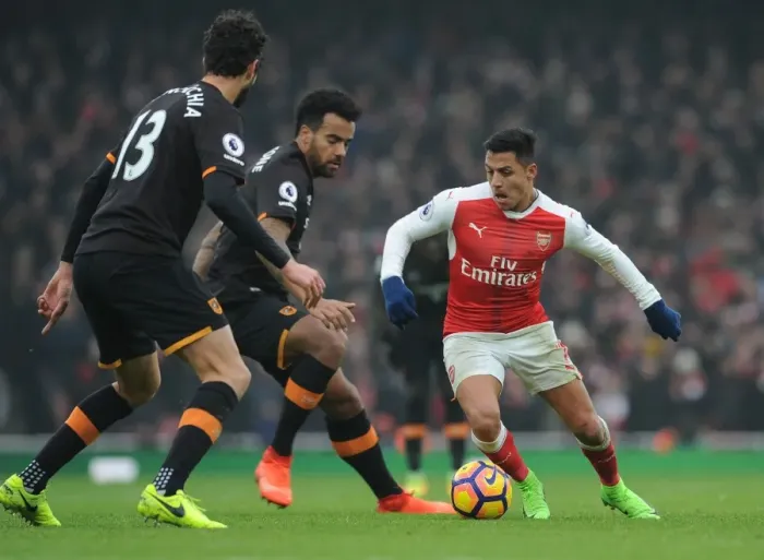 Framed Print : Arsenal's Alexis Sanchez Faces Off Against Hull City Defenders Framed Print : Arsenal's Alexis Sanchez Faces Off Against Hull City Defenders
