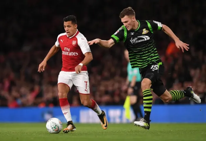 Framed Print : Arsenal's Alexis Sanchez Faces Off Against Joe Wright in Carabao Cup Battle