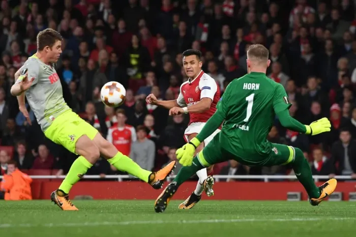 Framed Print : Arsenal's Alexis Sanchez Faces Off Against Marco Hoger and Timo Horn of FC Köln in Europa League Clash Framed Print : Arsenal's Alexis Sanchez Faces Off Against Marco Hoger and Timo Horn of FC Köln in Europa League Clash
