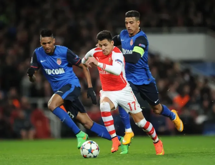 Framed Print : Arsenal's Alexis Sanchez Faces Off Against Monaco's Nabil Dirar and Anthony Martial in UEFA Champions League Showdown Framed Print : Arsenal's Alexis Sanchez Faces Off Against Monaco's Nabil Dirar and Anthony Martial in UEFA Champions League Showdown