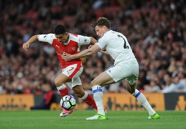 Arsenal's Alexis Sanchez Faces Off Against Sunderland's Billy Jones in Premier League Clash