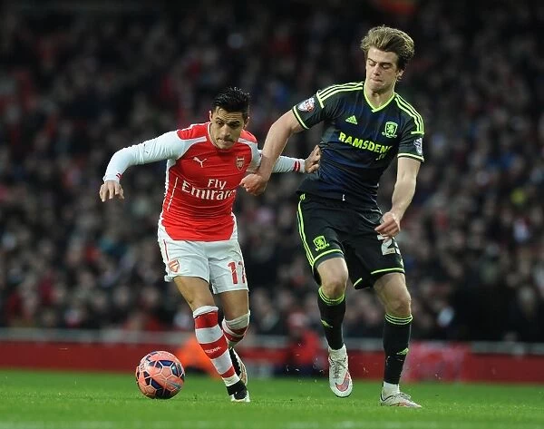 Arsenal's Alexis Sanchez Fends Off Middlesbrough's Patrick Bamford in FA Cup Clash