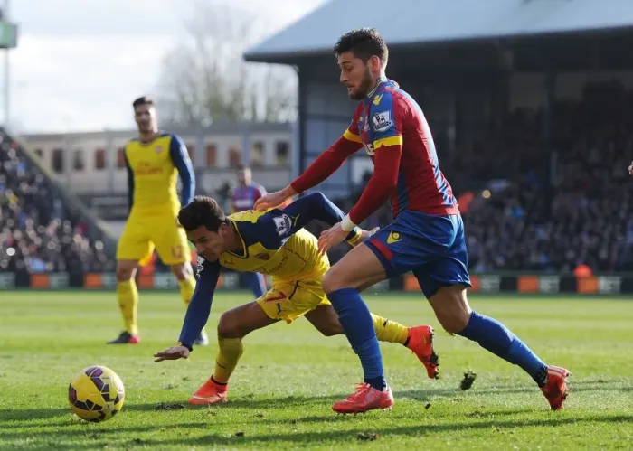 Framed Print : Arsenal's Alexis Sanchez Fends Off Crystal Palace's Joel Ward During Premier League Clash