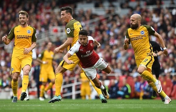 Arsenal's Alexis Sanchez Fouls by Brighton's Lewis Dunk in Premier League Clash