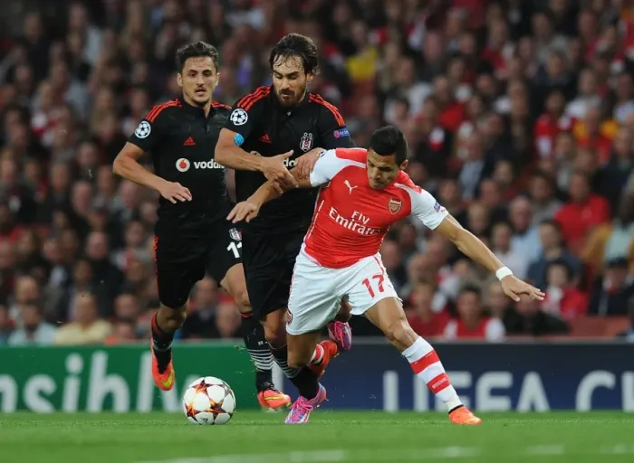 Framed Print : Arsenal's Alexis Sanchez Fouls Olcay Sahan in 2014 UEFA Champions League Qualifier Framed Print : Arsenal's Alexis Sanchez Fouls Olcay Sahan in 2014 UEFA Champions League Qualifier