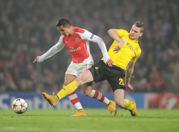 Framed Print : Arsenal's Alexis Sanchez Outmaneuvers Borussia Dortmund's Lukas Piszczek in 2014-15 Champions League Clash