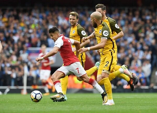 Arsenal's Alexis Sanchez Outmaneuvers Brighton's Pascal Gross