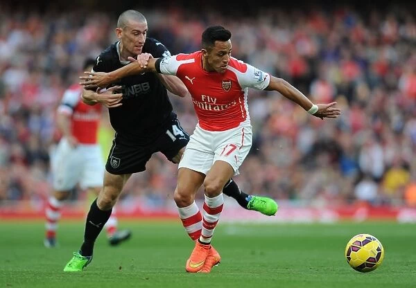 Arsenal's Alexis Sanchez Outmaneuvers Burnley's David Jones in 2014 / 15 Premier League Clash