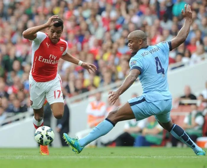 Framed Print : Arsenal's Alexis Sanchez Outmaneuvers Manchester City's Vincent Kompany