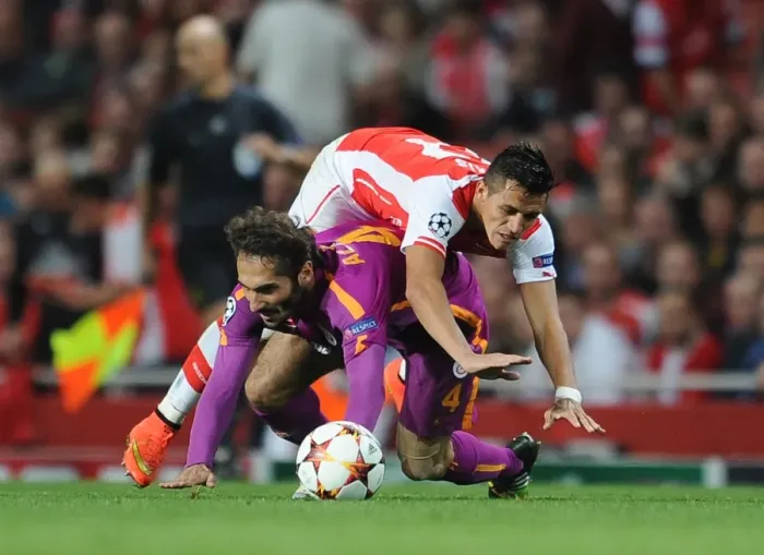 Framed Print : Arsenal's Alexis Sanchez Stumbles Against Galatasaray's Hamit Altintop - UEFA Champions League 2014 Framed Print : Arsenal's Alexis Sanchez Stumbles Against Galatasaray's Hamit Altintop - UEFA Champions League 2014