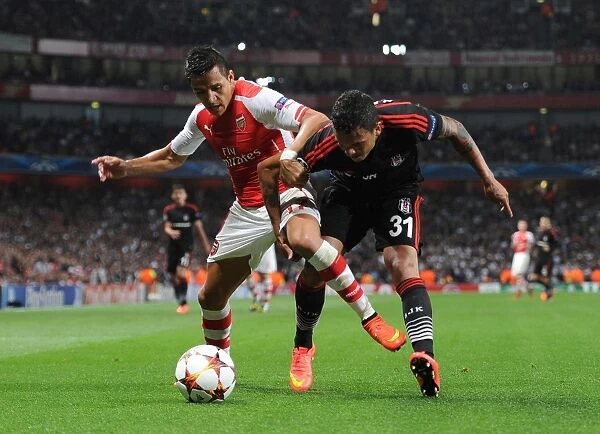 Arsenal's Alexis Sanchez Tackles Besiktas Ramon Motta in Champions League Showdown