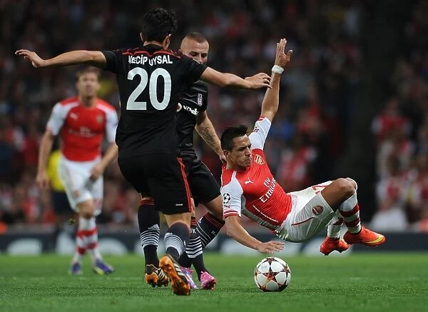 Arsenal's Alexis Sanchez Tripped by Besiktas Gokhan Tore in UEFA Champions League Clash