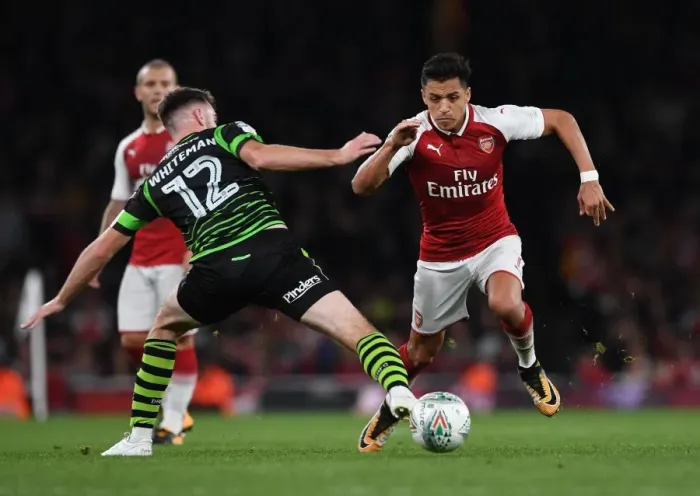 Framed Print : Arsenal's Alexis Sanchez vs. Ben Whiteman: A Carabao Cup Battle at Emirates Stadium Framed Print : Arsenal's Alexis Sanchez vs. Ben Whiteman: A Carabao Cup Battle at Emirates Stadium