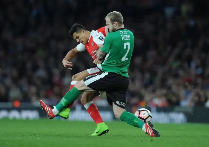 Framed Print : Arsenal's Alexis Sanchez vs. Bradley Wood: FA Cup Quarter-Final Showdown at Emirates Stadium Framed Print : Arsenal's Alexis Sanchez vs. Bradley Wood: FA Cup Quarter-Final Showdown at Emirates Stadium