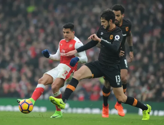 Framed Print : Arsenal's Alexis Sanchez vs. Hull City's Andrea Ranocchia: A Premier League Showdown at Emirates Stadium