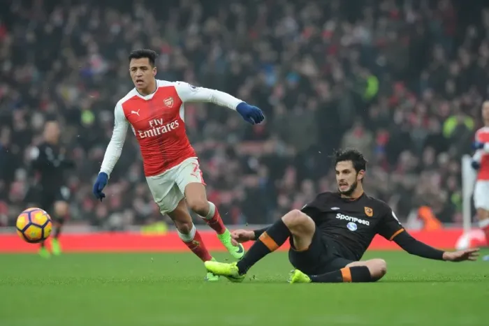 Framed Print : Arsenal's Alexis Sanchez vs. Hull City's Andrea Ranocchia: A Premier League Showdown at Emirates Stadium