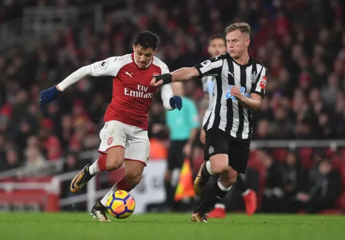 Framed Print : Arsenal's Alexis Sanchez vs. Newcastle's Matt Ritchie: A Premier League Showdown Framed Print : Arsenal's Alexis Sanchez vs. Newcastle's Matt Ritchie: A Premier League Showdown