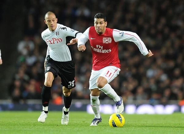 Arsenal's Andre Santos Clashes with Fulham's Bobby Zamora in Premier League Showdown