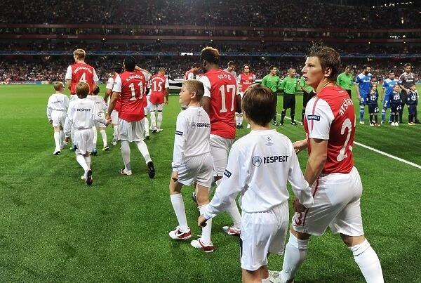 Arsenal's Andrey Arshavin Leads Out Team against Olympiacos in 2011-12 UEFA Champions League