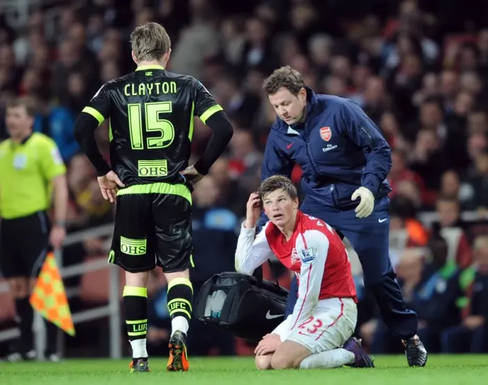Framed Print : Arsenal's Andrey Arshavin Receives Treatment from Physio during Arsenal v Leeds United FA Cup Match Framed Print : Arsenal's Andrey Arshavin Receives Treatment from Physio during Arsenal v Leeds United FA Cup Match