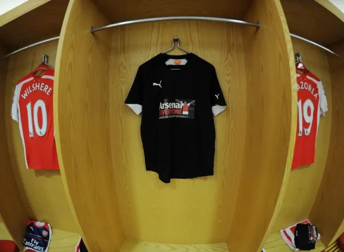 Framed Print : Arsenal's Arsenal For Everyone T-Shirts in Home Changing Room (Arsenal vs Hull City, 2014-15)