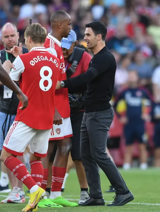 Framed Print : Arsenal's Arteta Celebrates with Magalhaes after Arsenal's Victory over Fulham (2022-23) Framed Print : Arsenal's Arteta Celebrates with Magalhaes after Arsenal's Victory over Fulham (2022-23)