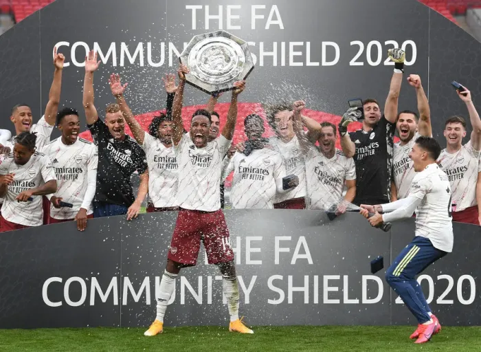Framed Print : Arsenal's Aubameyang Celebrates FA Community Shield Victory with Champagne Deluge Framed Print : Arsenal's Aubameyang Celebrates FA Community Shield Victory with Champagne Deluge