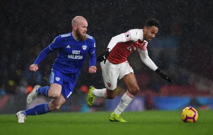 Framed Print : Arsenal's Aubameyang Clashes with Cardiff's Gunnarsson in Premier League Showdown Framed Print : Arsenal's Aubameyang Clashes with Cardiff's Gunnarsson in Premier League Showdown