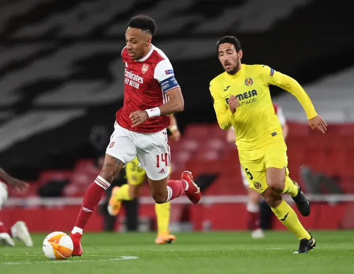Framed Print : Arsenal's Aubameyang Clashes with Parejo in Empty Europa League Semi-Final