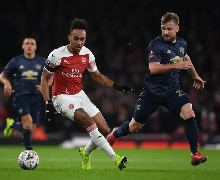 Framed Print : Arsenal's Aubameyang Clashes with Shaw in FA Cup Battle at Emirates Stadium: Arsenal vs Manchester United Framed Print : Arsenal's Aubameyang Clashes with Shaw in FA Cup Battle at Emirates Stadium: Arsenal vs Manchester United