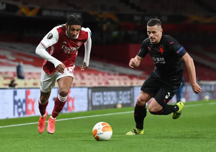 Framed Print : Arsenal's Aubameyang Clashes with Slavia's Holes in Empty Europa League Quarterfinal Framed Print : Arsenal's Aubameyang Clashes with Slavia's Holes in Empty Europa League Quarterfinal