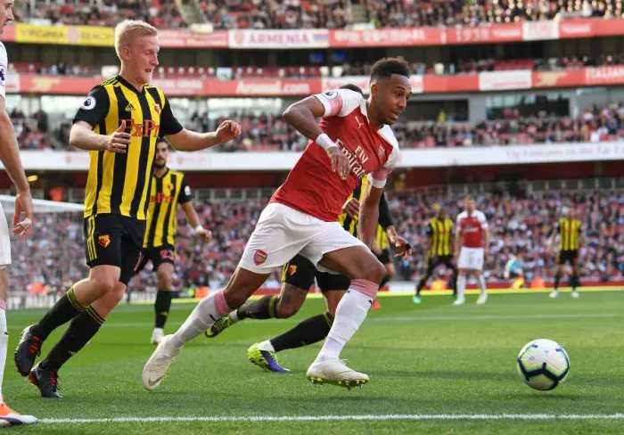 Framed Print : Arsenal's Aubameyang Clashes with Watford's Hughes in Premier League Showdown