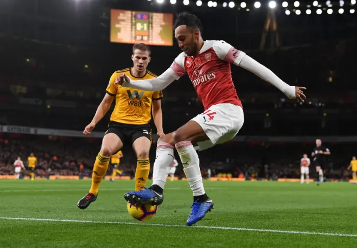 Framed Print : Arsenal's Aubameyang Clashes with Wolves Bennett in Premier League Showdown Framed Print : Arsenal's Aubameyang Clashes with Wolves Bennett in Premier League Showdown